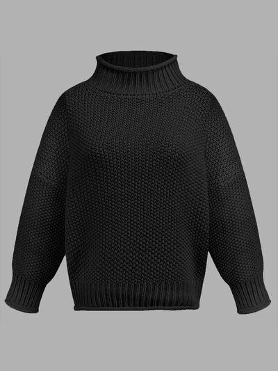 a black sweater on a gray background