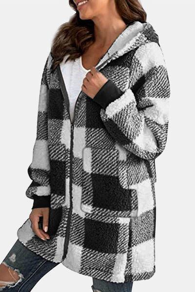 a woman wearing a black and white checkered coat