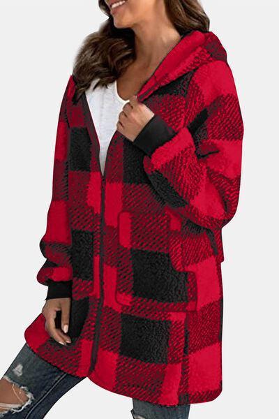 a woman wearing a red and black checkered coat