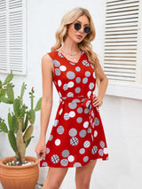 a woman in a red polka dot dress