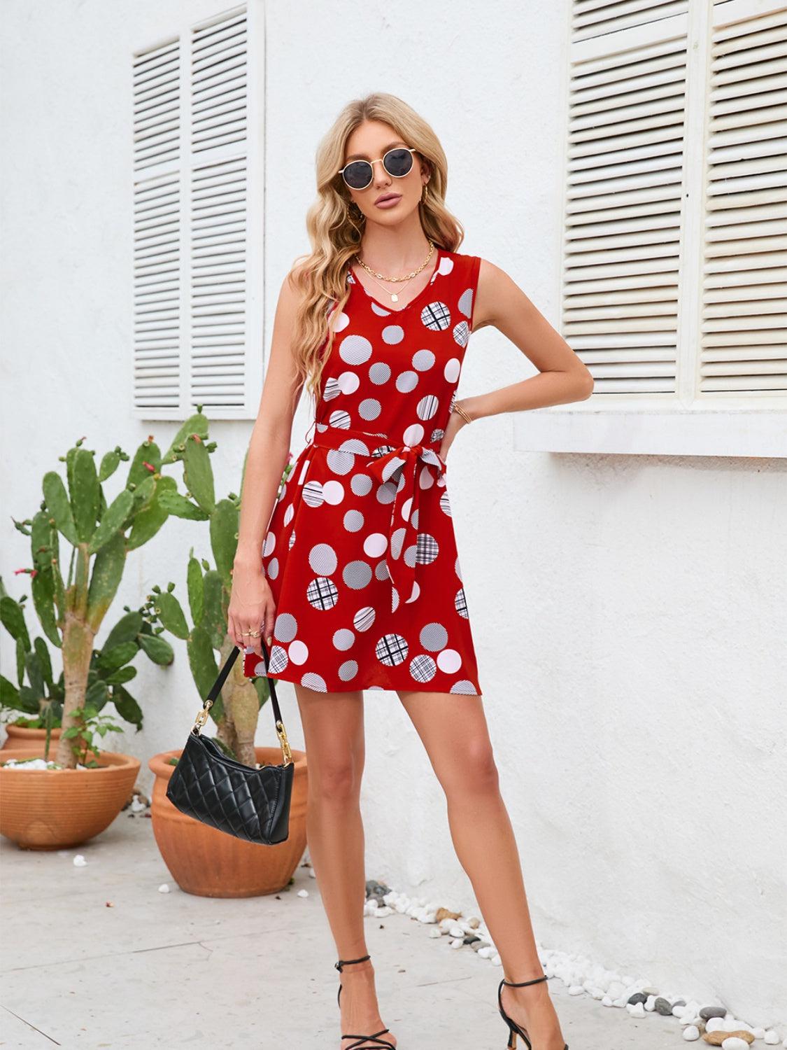 a woman in a red polka dot dress