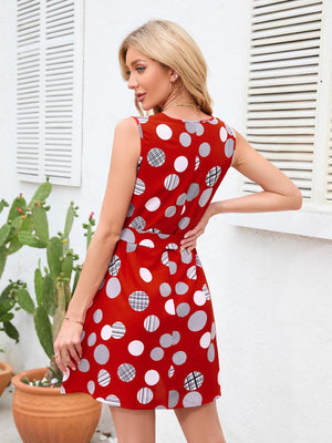 a woman in a red polka dot dress