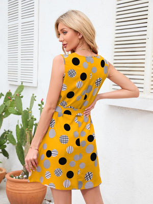 a woman in a yellow polka dot dress