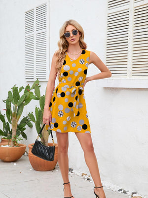 a woman in a yellow polka dot dress