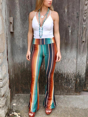 a woman standing in front of a wooden door