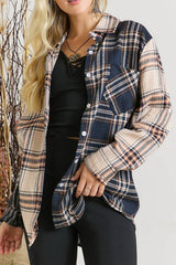 a woman wearing a plaid shirt and black pants