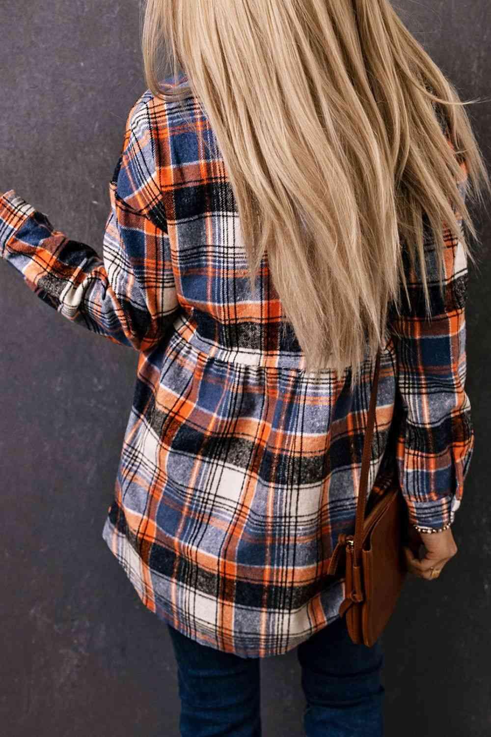 a woman with long blonde hair wearing a plaid shirt