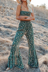 a woman standing in a field wearing a hat