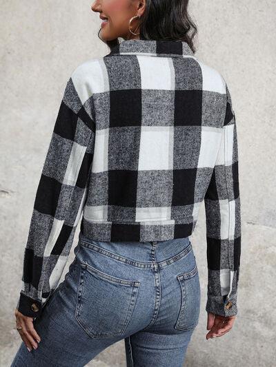 a woman wearing a black and white checkered shirt