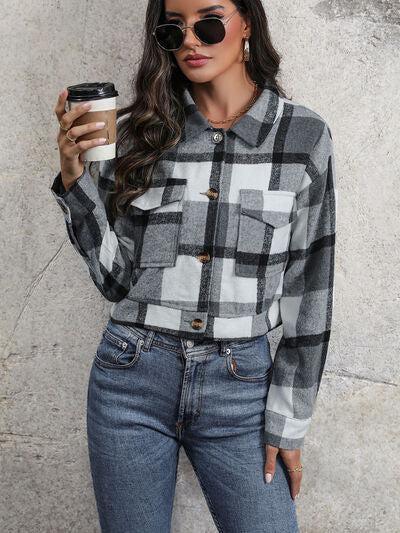 a woman holding a cup of coffee in her hand