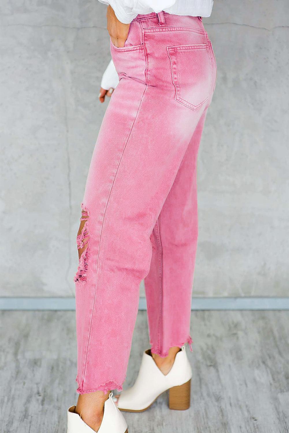 a woman wearing pink jeans and white shoes