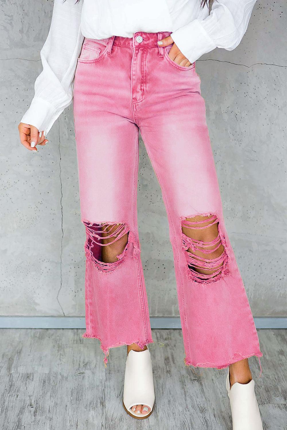 a woman in a white shirt and pink jeans