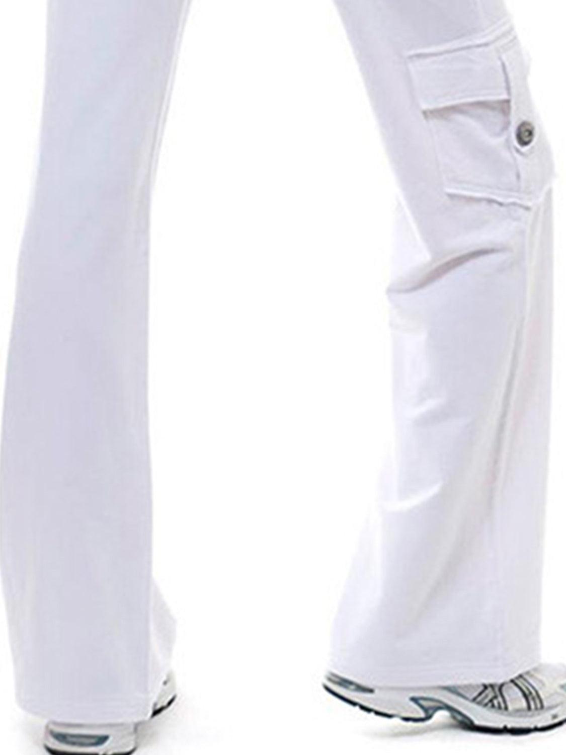 a woman wearing white pants and a white shirt