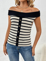 a woman wearing a black and white striped top