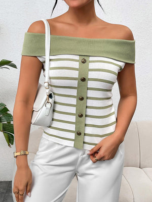 a woman wearing a green and white striped top