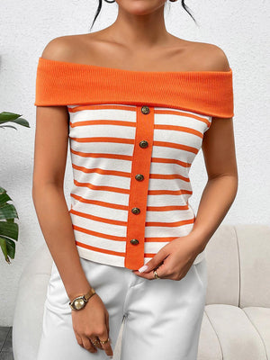 a woman wearing an orange and white striped top