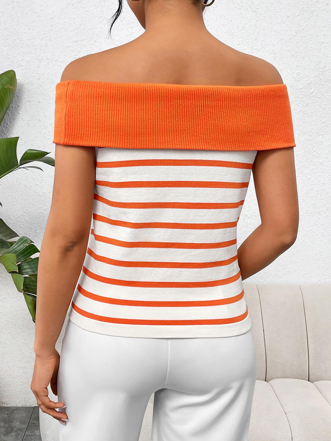 a woman wearing an orange and white striped top
