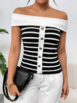 a woman wearing a black and white striped top