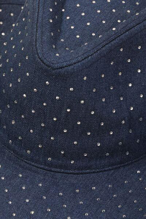 a blue hat with white dots on it