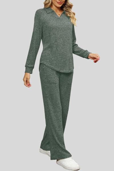 a woman wearing a green sweater and pants