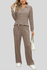 a woman wearing a brown sweater and pants