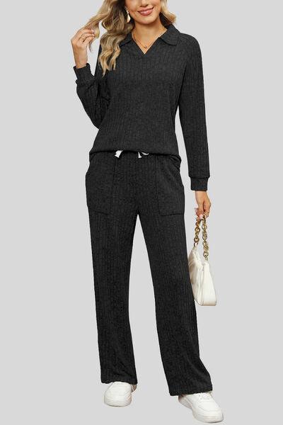 a woman wearing a black sweater and pants