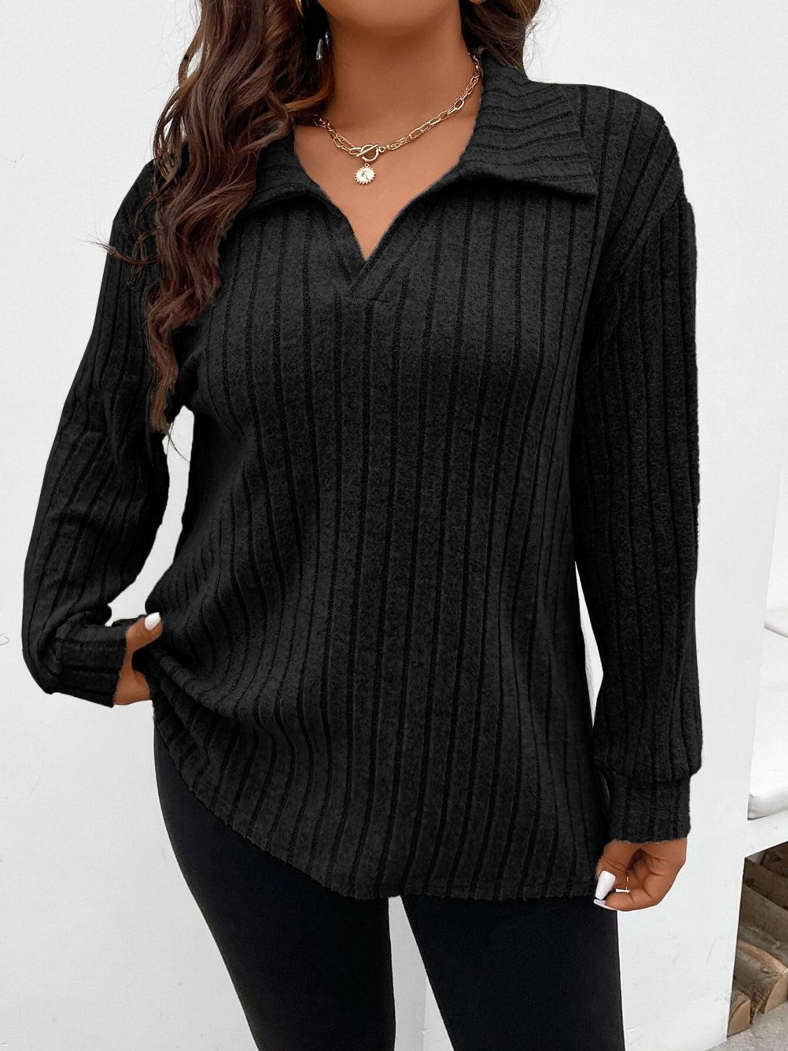 a woman wearing a black sweater and leggings