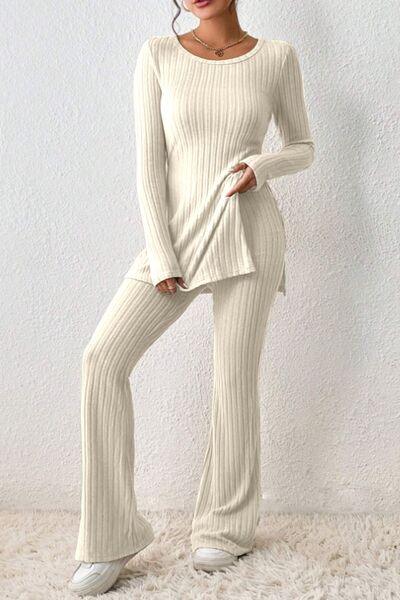 a woman in a white sweater and pants