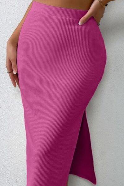 a woman wearing a pink skirt and heels