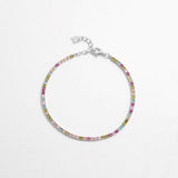 a bracelet with multicolored beads on a white background