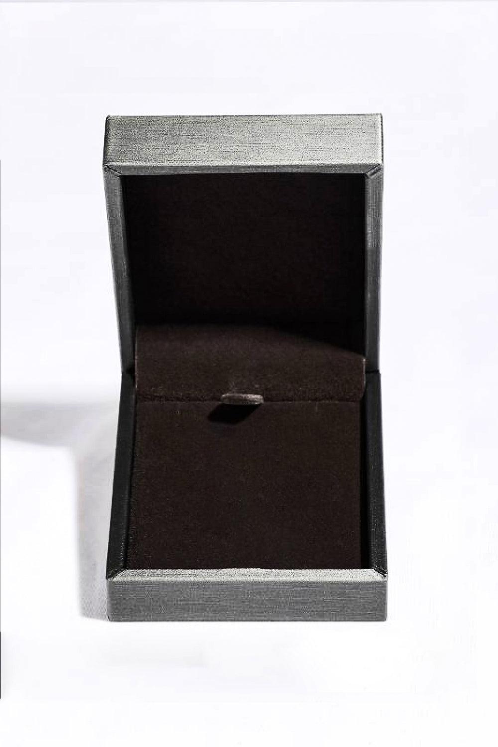 an open box with a ring inside of it
