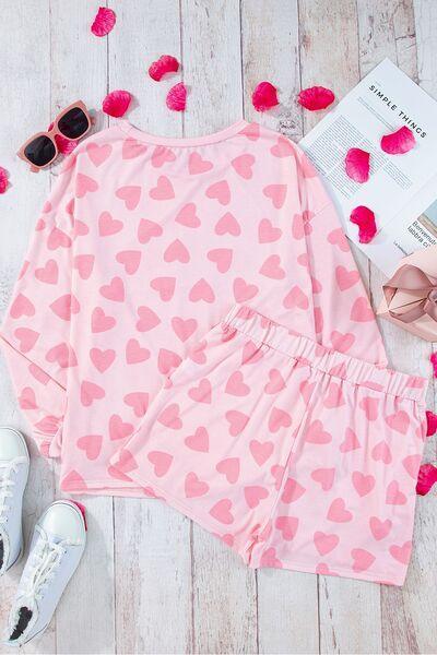 a pink top and shorts with hearts on it