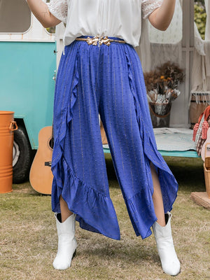 a woman in a white shirt and blue skirt