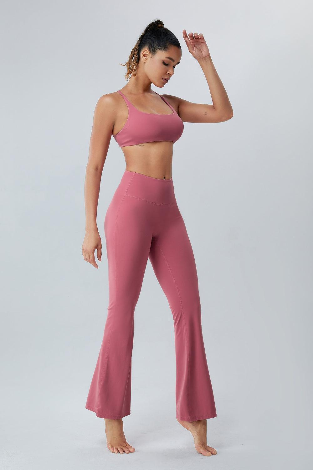 a woman in a pink top and pants
