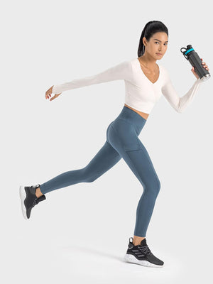 a woman is running with a water bottle in her hand