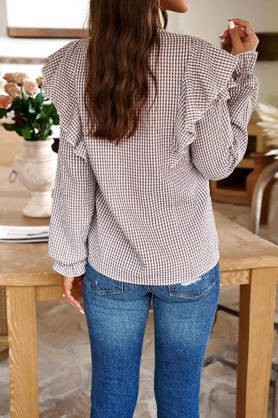 a woman standing in front of a wooden table