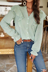 a woman wearing a green and white checkered shirt