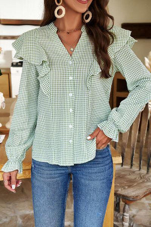 a woman wearing a green and white checkered shirt