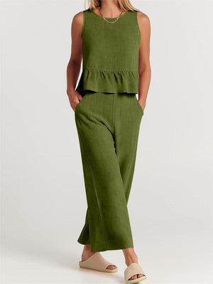 a woman in a green top and pants