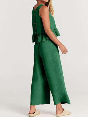 a woman wearing a green jumpsuit with buttons