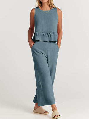 a woman in a blue top and pants
