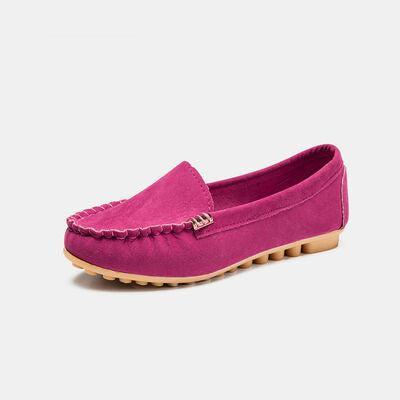 a women's pink loafer with a wooden sole
