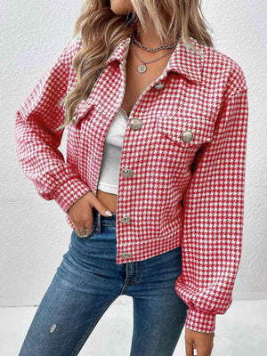 a woman wearing a red and white checkered jacket