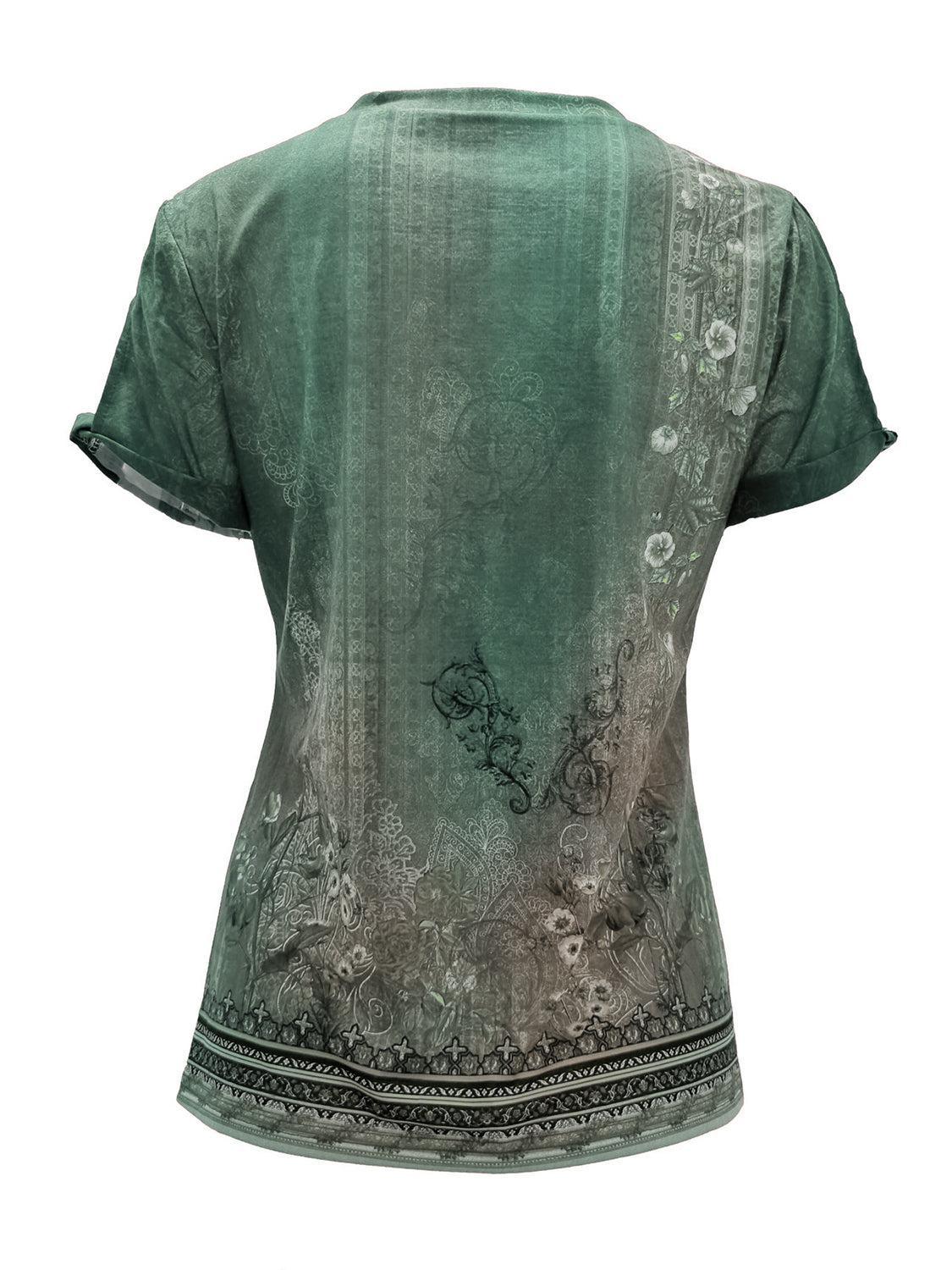 a woman's green top with a floral design