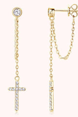 a pair of cross and chain earrings