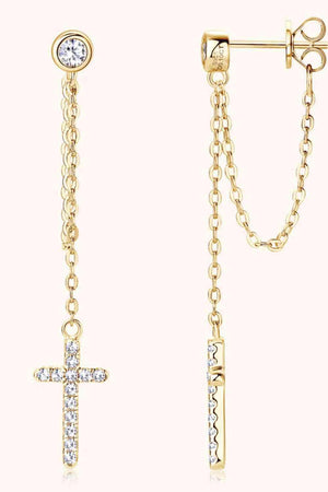 a pair of cross and chain earrings