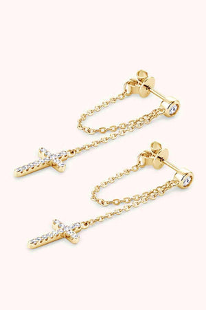 a pair of earrings with a cross on it