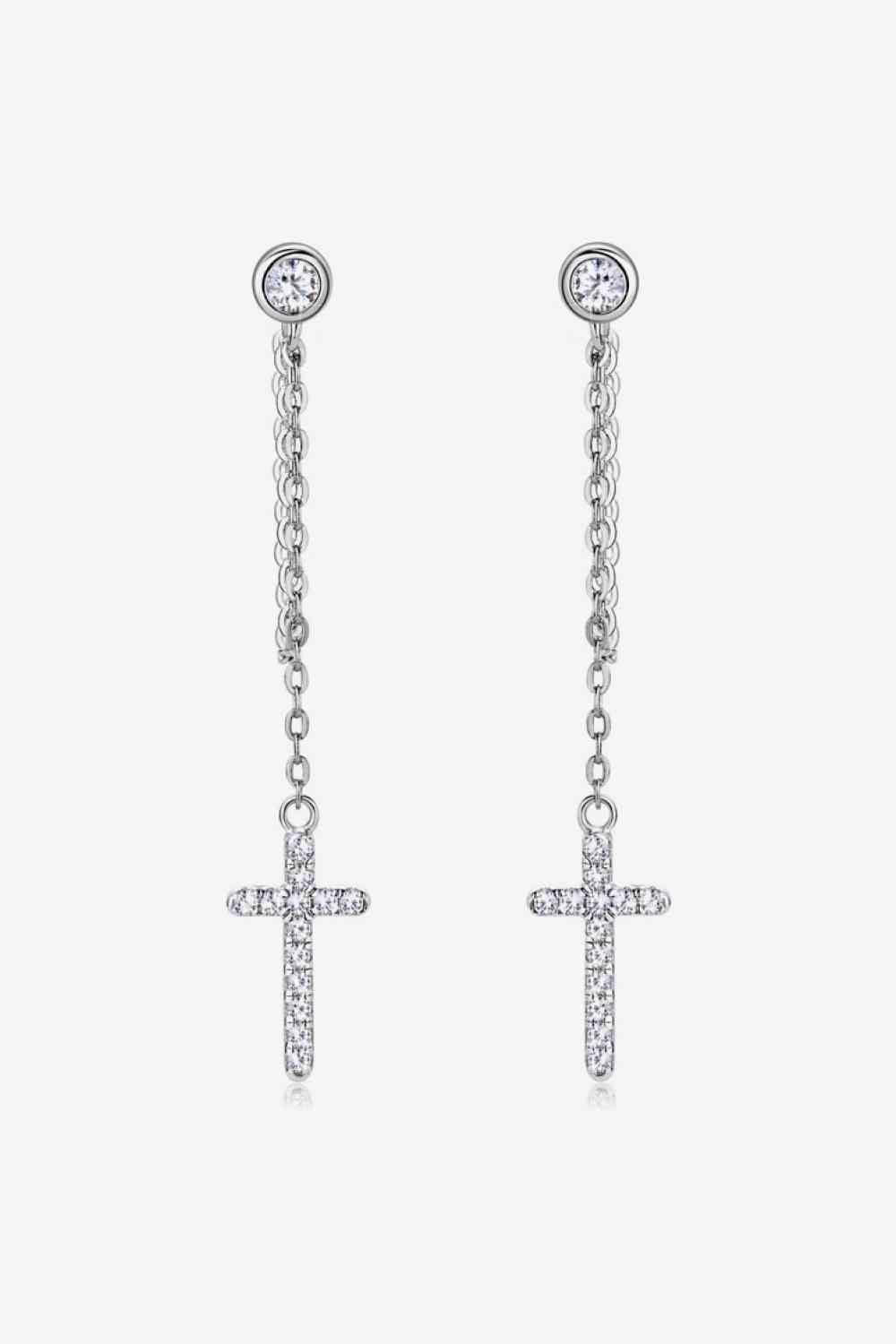 a pair of earrings with a cross on it