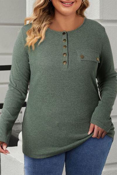 a woman wearing a green shirt and jeans