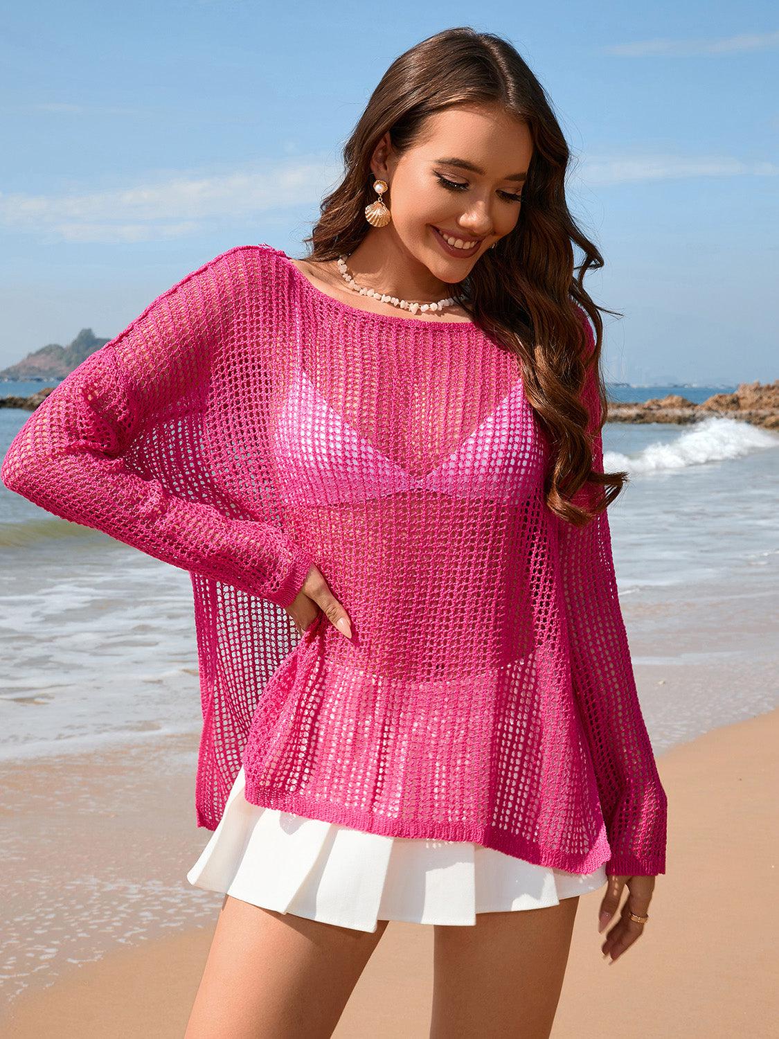 a woman standing on a beach next to the ocean